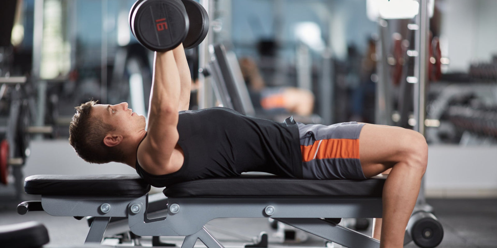 man tightens chest skin doing weights