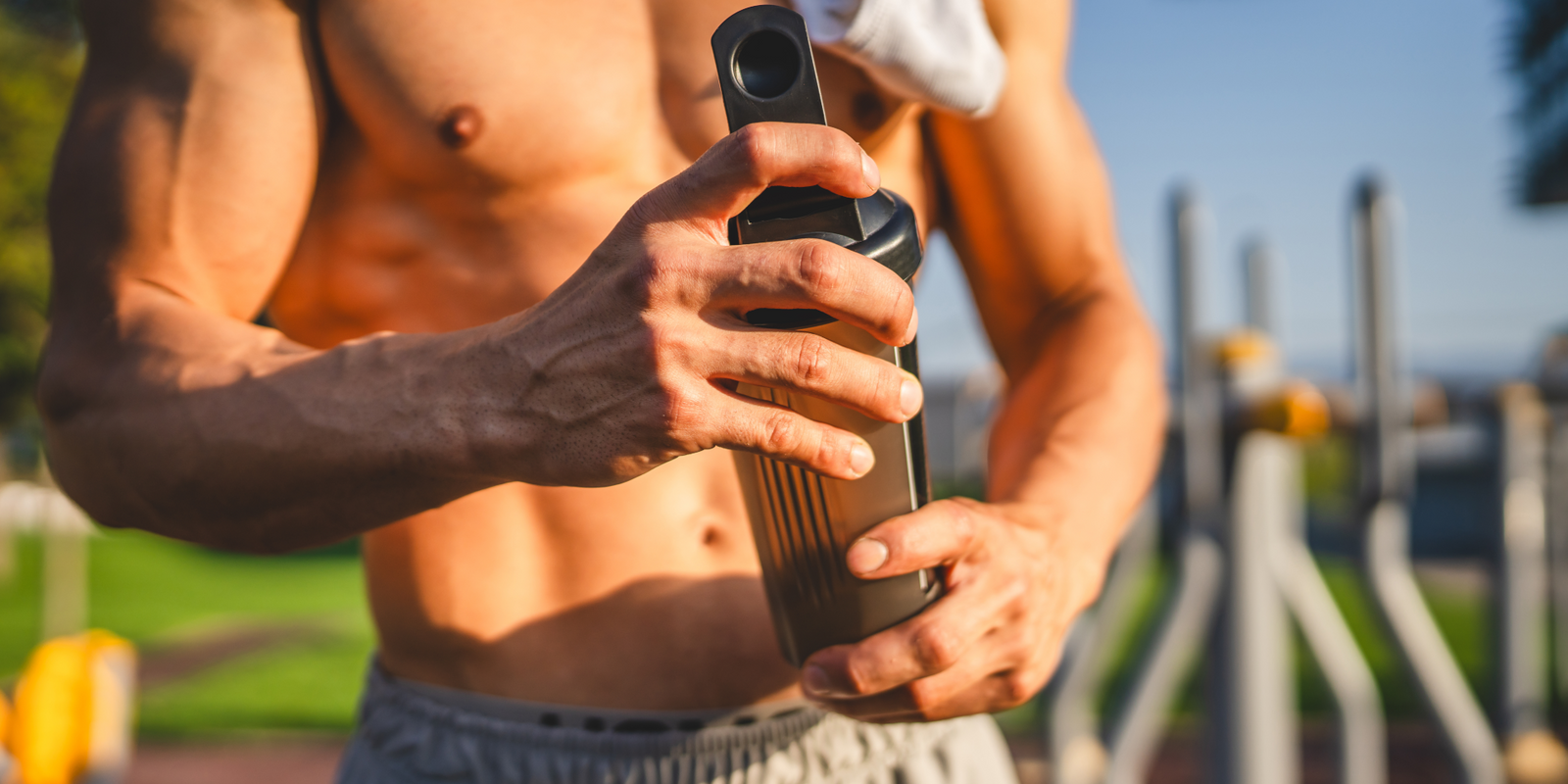 Man holding bodybuilding supplement