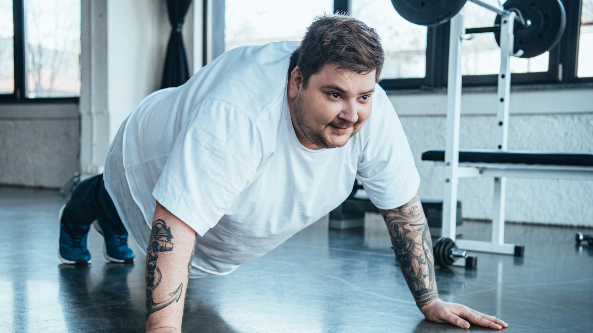 Man doing push ups to lose man boobs